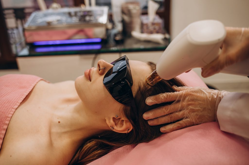 Inicio 6 Cosmetology. Woman At Hair Growth Laser Stimulation Treatment